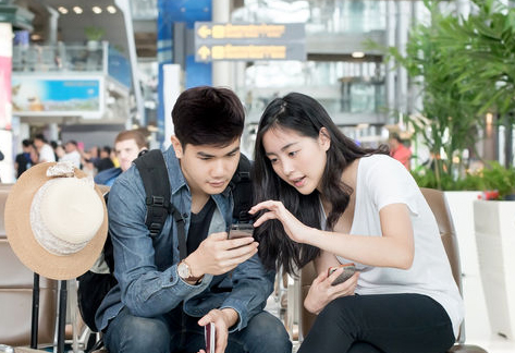 Couple using a smartphone when traveling