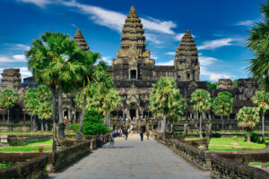 Tourists walking the grounds of Angkor Wat